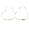 Heart Wire Hoop Earrings in Gold